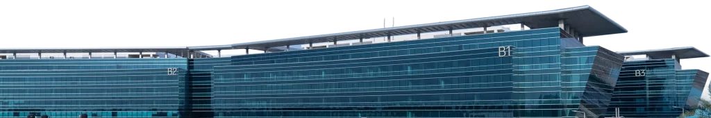 Modern office building with glass facade, labeled B1, B2, and B3. A place to begin.